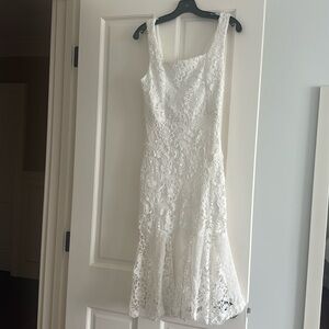 Eyelet looking dress. Lined to ruffle.